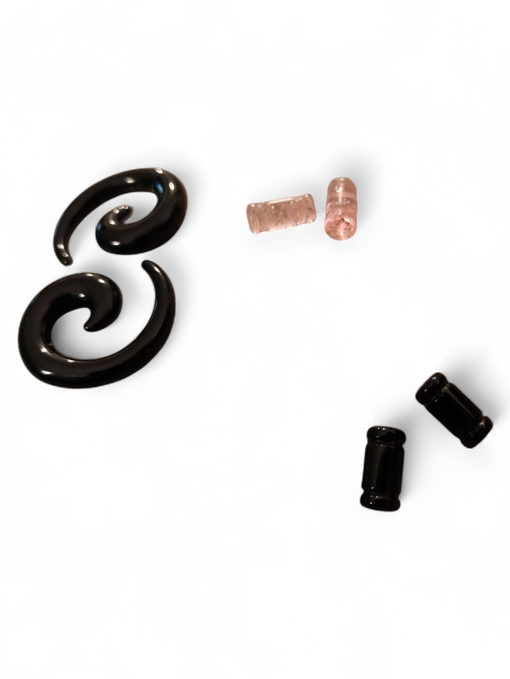 Black Spiral Ear Stretchers with Sparkle Pink And Black Plugs